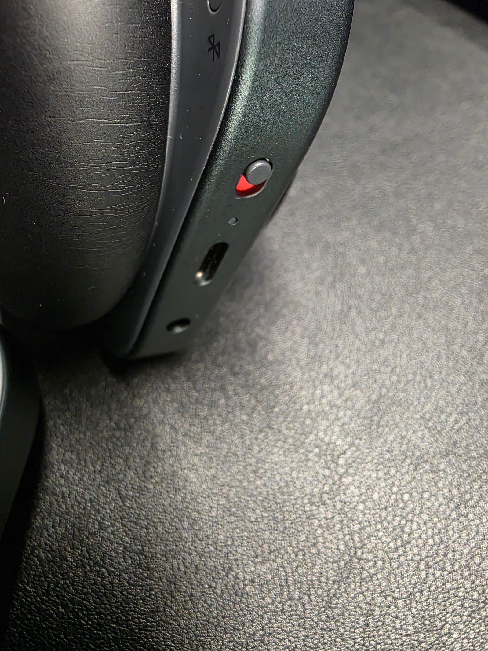 At top: power switch; in the middle, USB C port; at the bottom, 3.5mm audio port