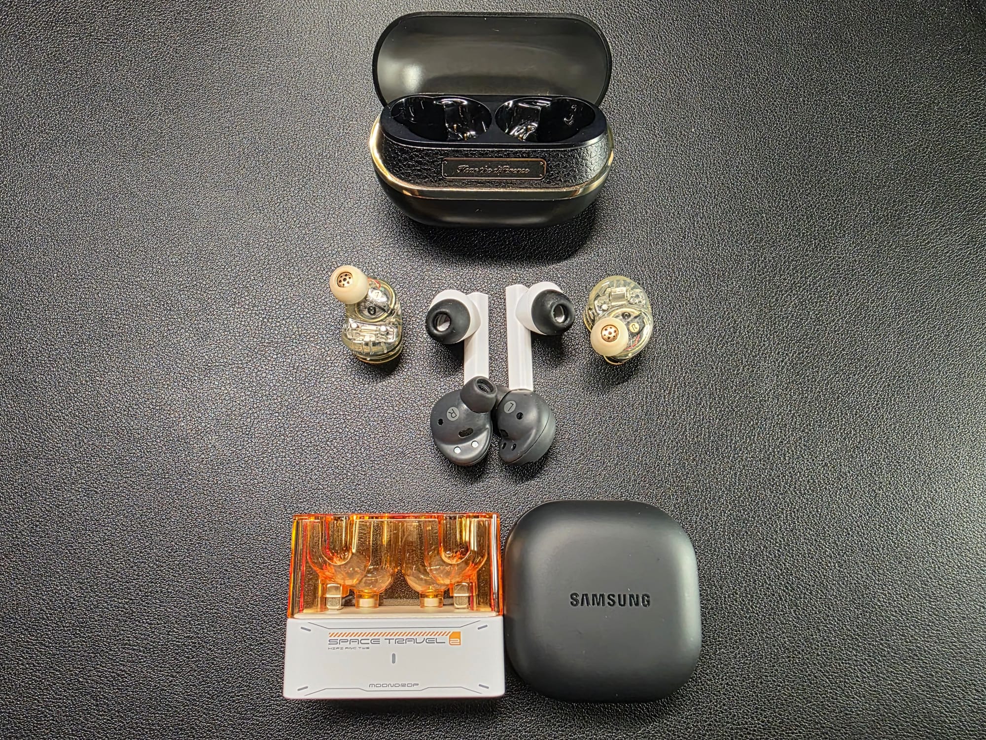 H3 pictured along with the Moondrop Space Travel 2 and Samsung Buds 2 Pro - Space Travel 2 are stem-style and Buds 2 Pro are earbud style