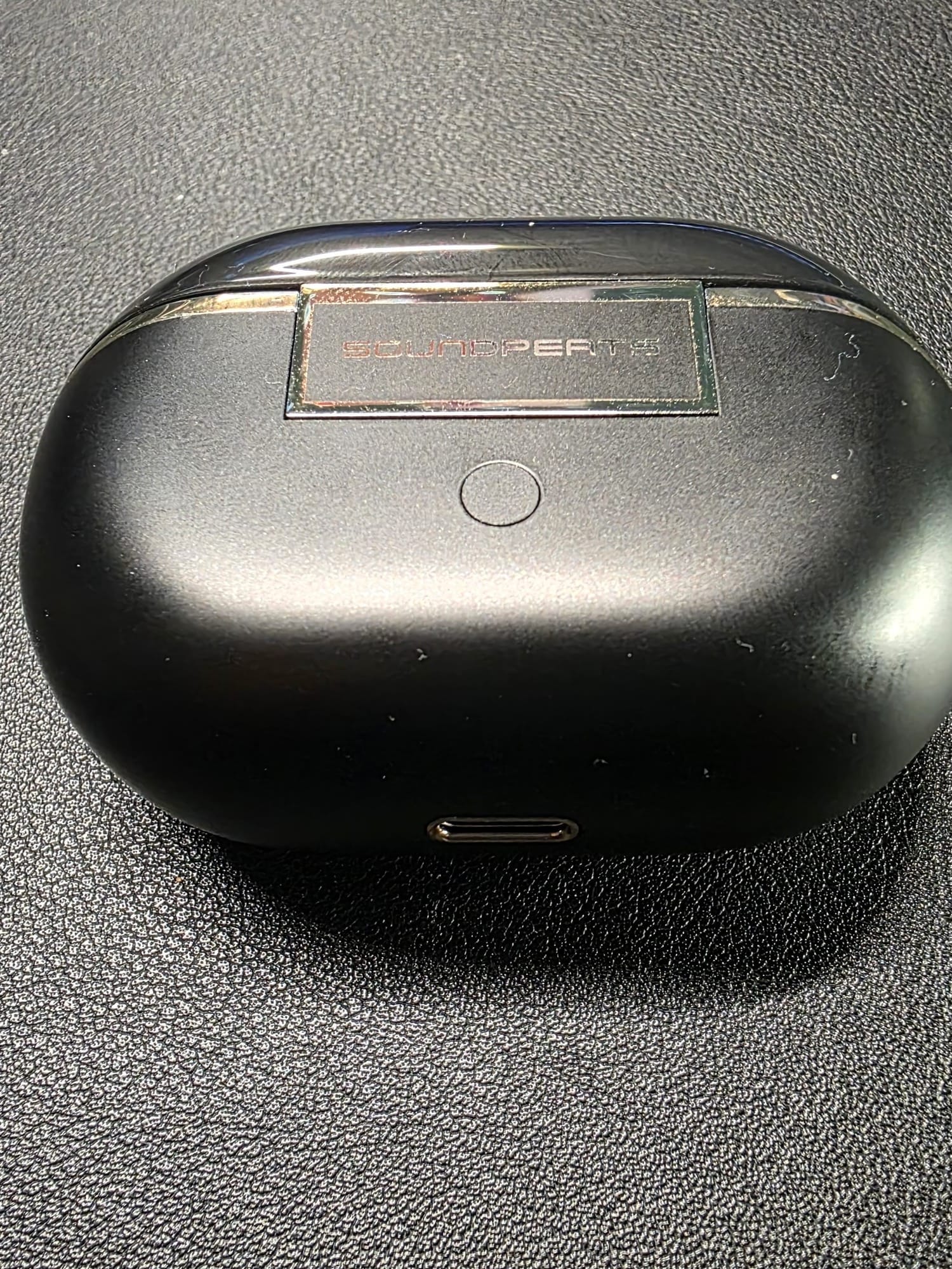 Charging case from the rear and bottom - on the rear is the reset button and on the bottom is the USB C port