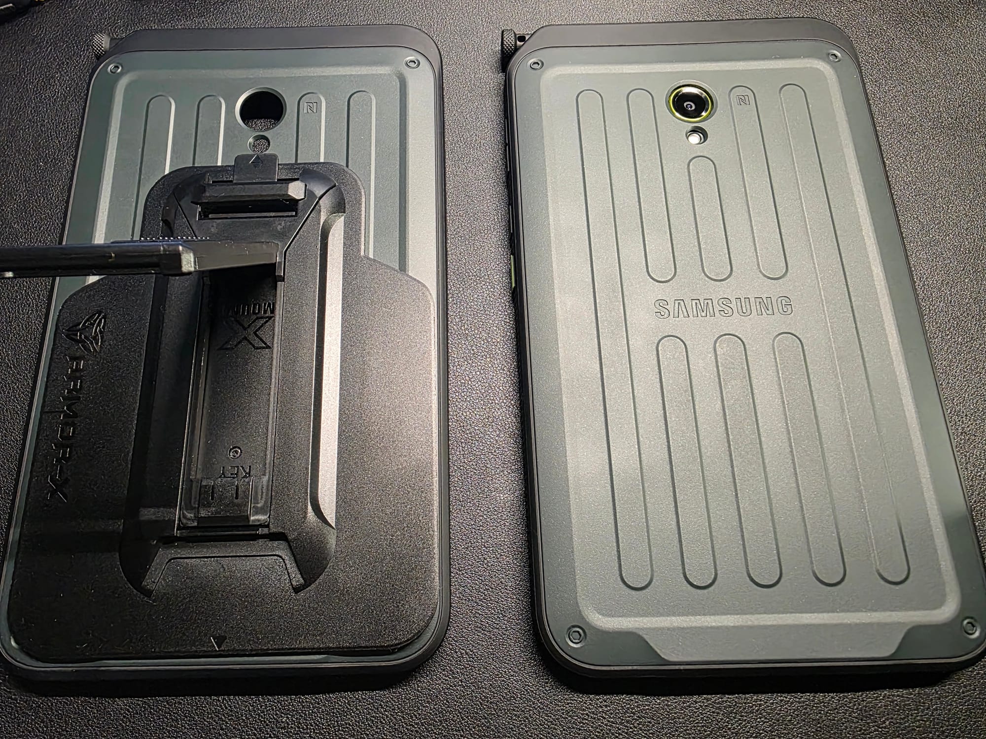 My two OEM tablet cases, one with a kickstand from Armor-X attached to it