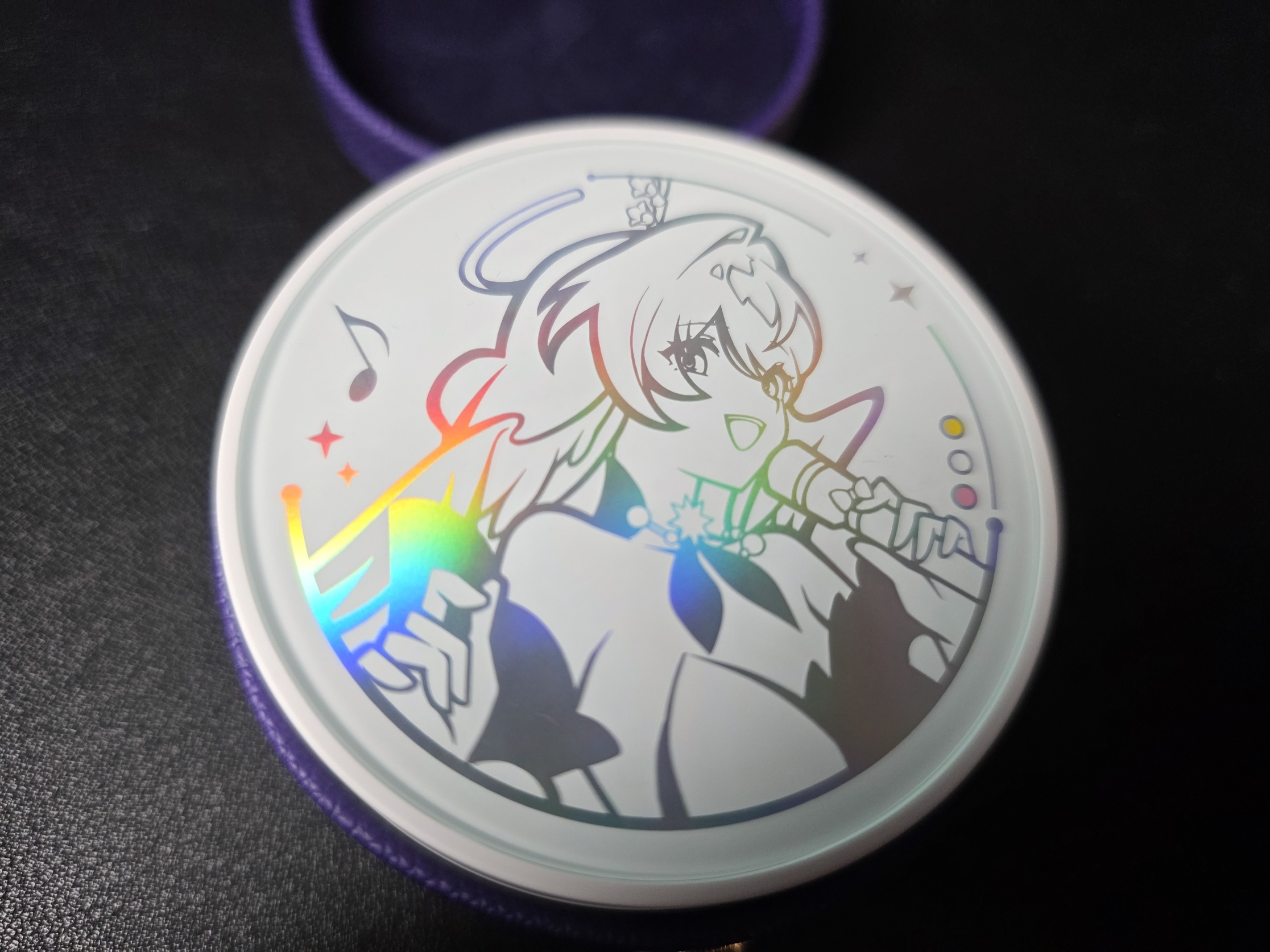 A silkscreen-style image of Robin appears on the lid of the charging case
