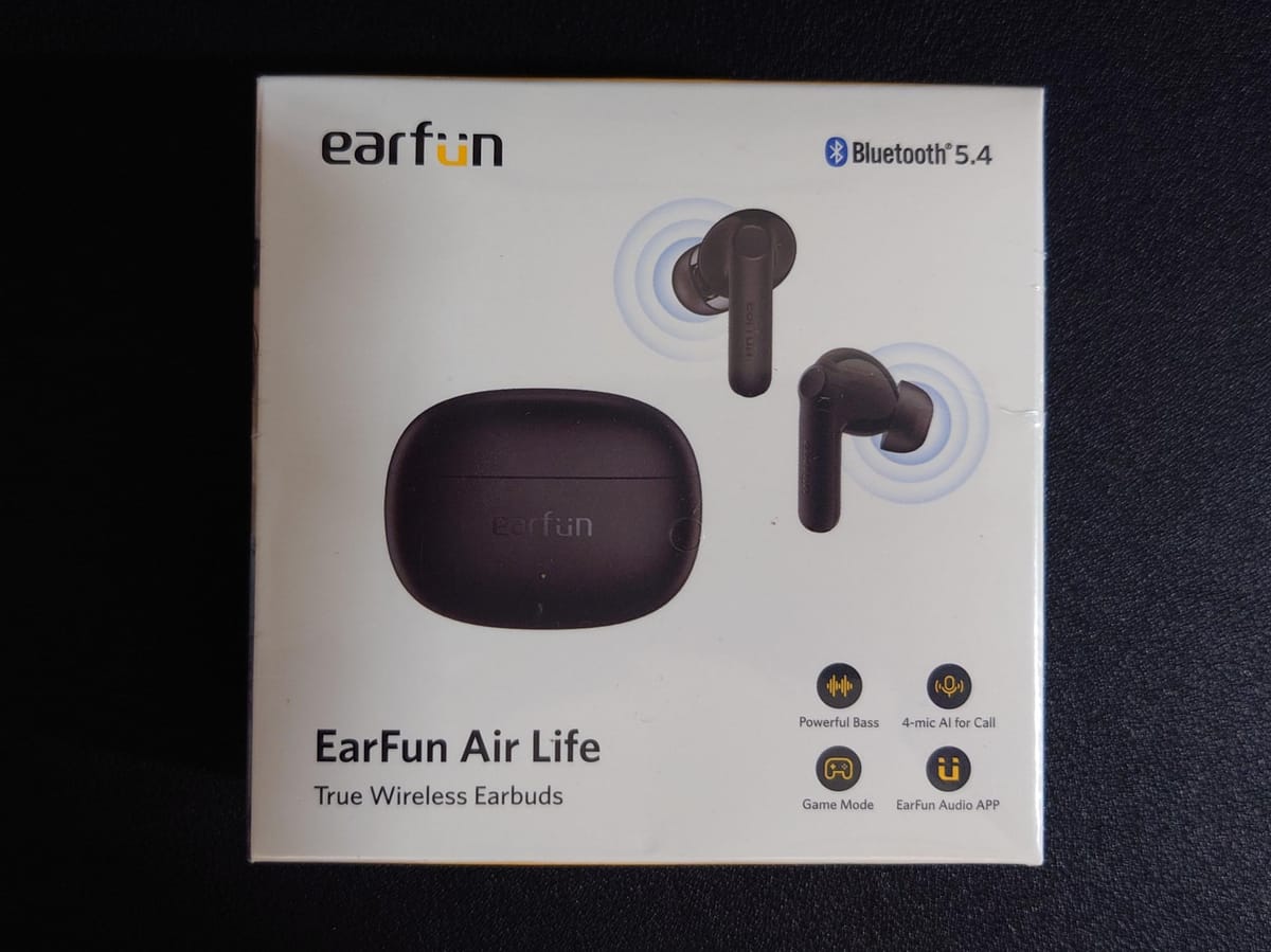 Photo of the box the earbuds come in, listing features such as 4 mics for calls, powerful bass, and audio app