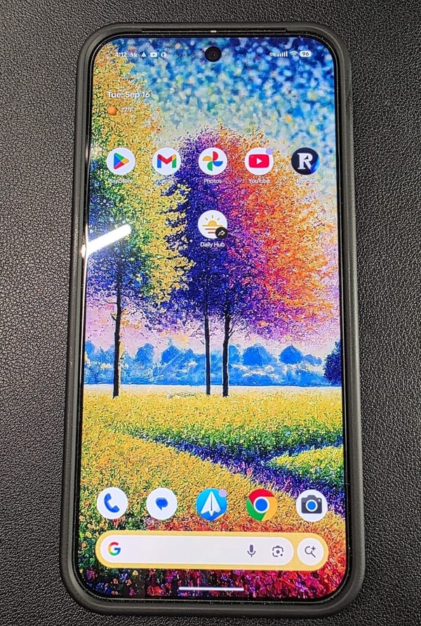 My Pixel 9 Pro XL showing its home screen with colorul AI-generated wallpaper of a fieldof flowers and trees in a pointillism style showcasing oranges, greens, purples, and blues