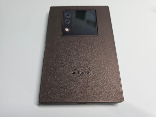 The Unihertz Titan 2 with rear screen facing up - the phone is lying face down on a white background